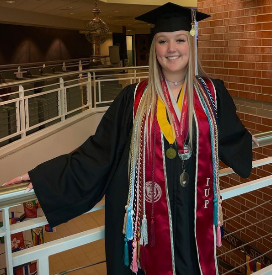 Sarina in her cap and gown for IUP graduation